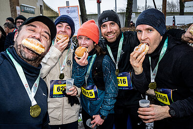 Participants celebrate their run at the finish line with pancakes.